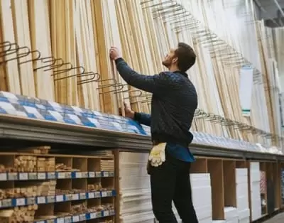 Man selecting wood planks